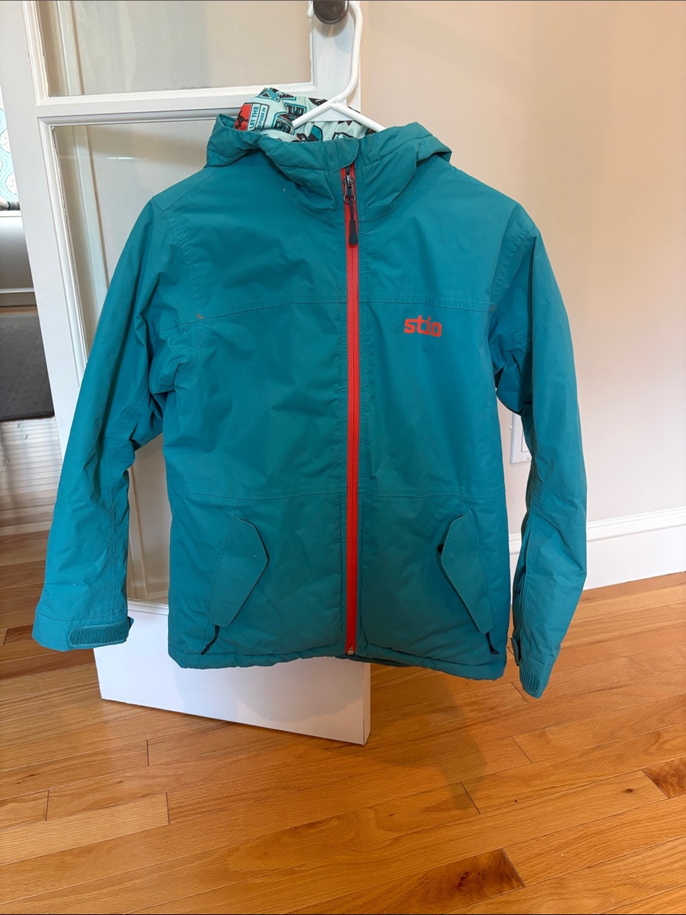 Stio Teal Kids Rain Jacket with Red Zip Accents